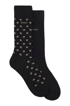 Ensemble de bas mi-mollet noirs, un à motif beige et blanc et un uni avec logo BOSS, vue produit pour homme par HUGO BOSS
