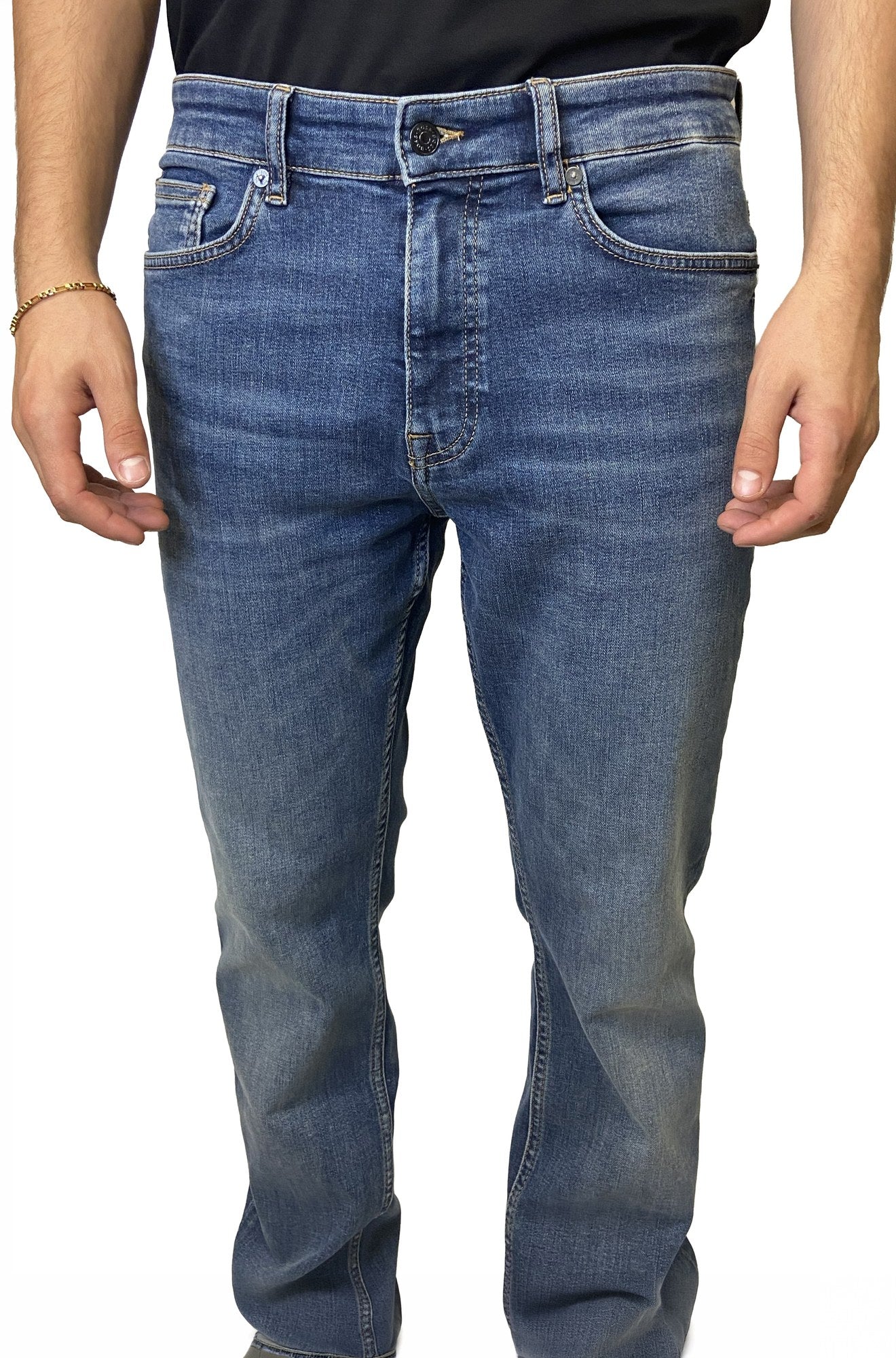 Front view of men's medium blue washed straight-leg jeans with button fly area and five-pocket styling by HUGO BOSS
