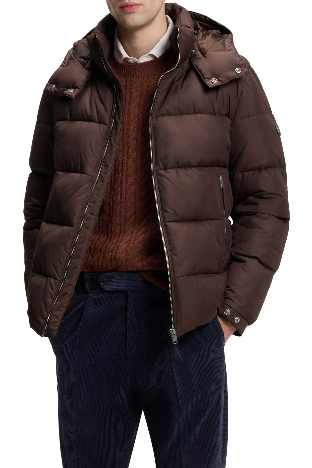 Men's angled front view of the dark brown hooded puffer winter puffer jacket worn open over layered styling by HUGO BOSS