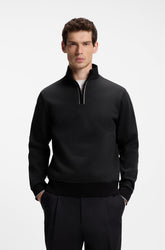 Chandail à demi-fermeture éclair sport noir sur mannequin, col montant, vue de face pour homme par HUGO BOSS