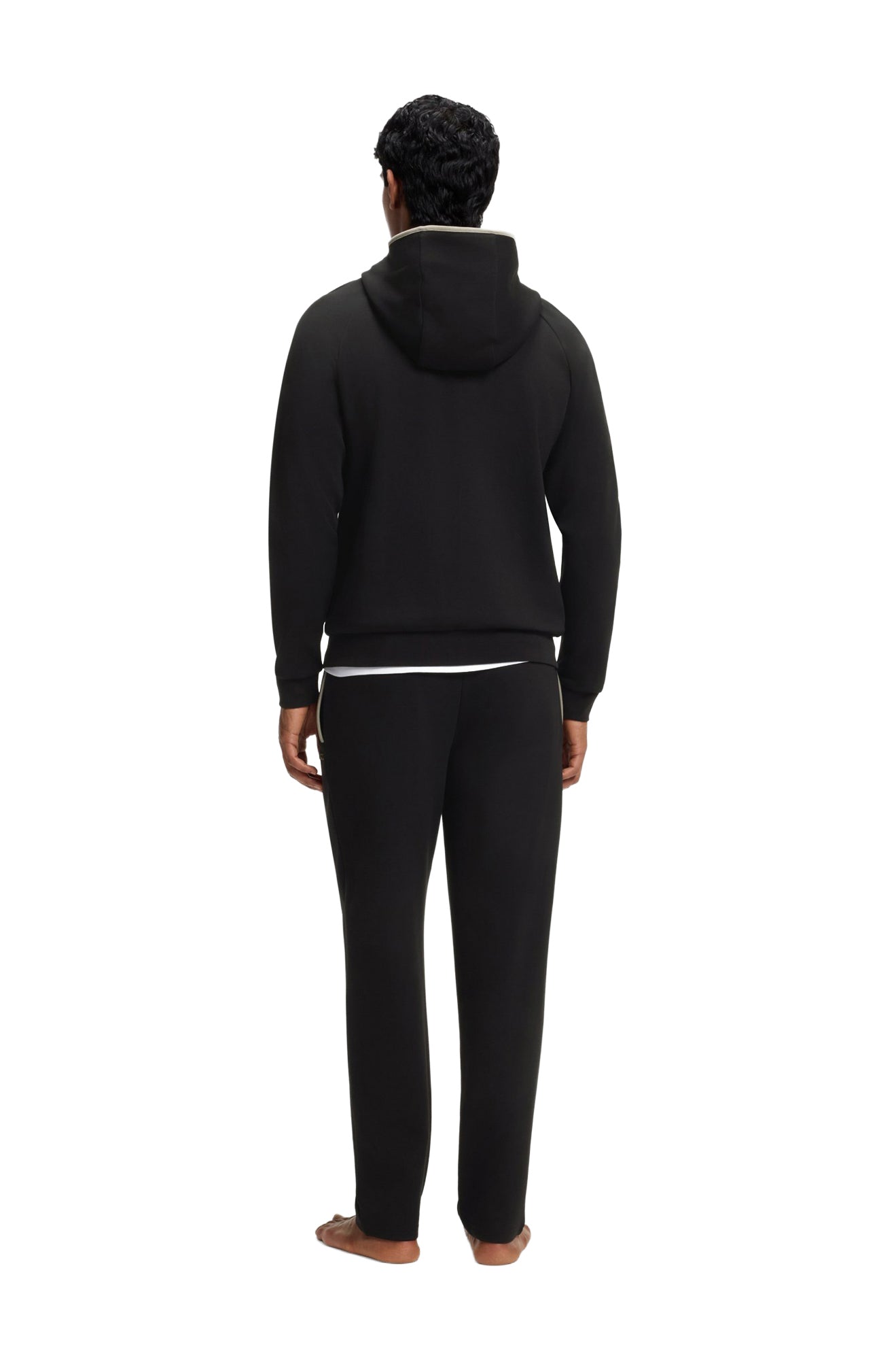Vue arrière du veste à zip à capuchon noir sur mannequin avec capuchon et ourlet côtelé pour homme par HUGO BOSS
