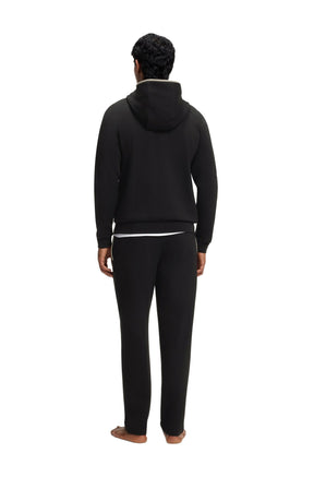 Vue arrière du veste à zip à capuchon noir sur mannequin avec capuchon et ourlet côtelé pour homme par HUGO BOSS