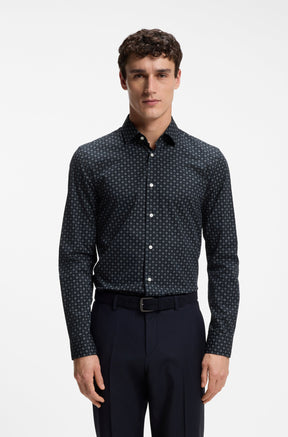 Men's navy long sleeve dress shirt on model, front view, with small geometric print and white buttons by HUGO BOSS