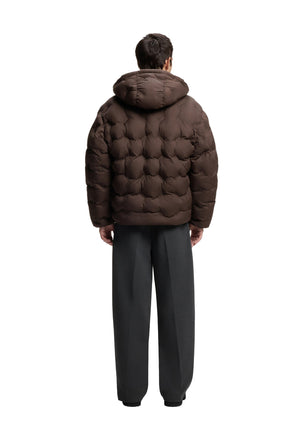 Back view of men's dark brown hooded puffer jacket showing raised geometric quilting and boxy shape by HUGO BOSS
