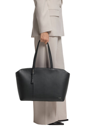 Mannequin tenant un sac fourre-tout noir structuré avec longues poignées, vue de cote pour femme par HUGO BOSS