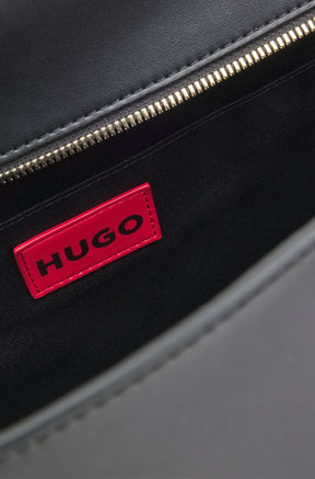 Détail intérieur du sac fourre-tout noir avec doublure noire et glissière dorée pour femme par HUGO BOSS
