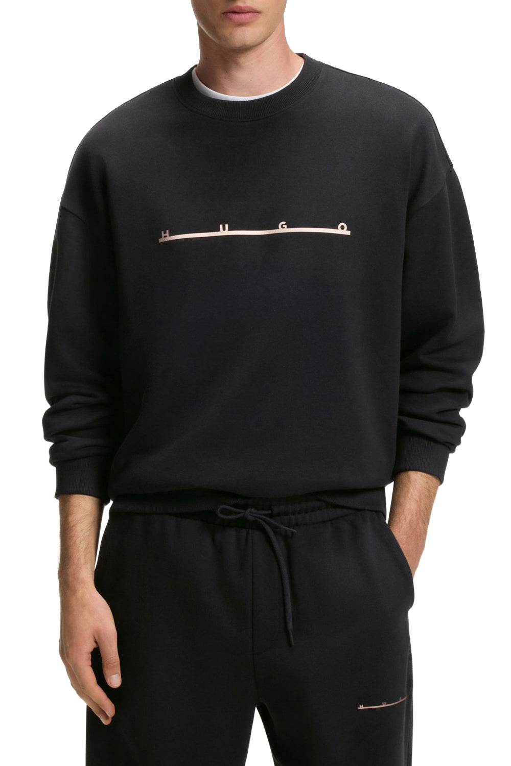 HUGO BOSS men's black crewneck sweatshirt with beige HUGO line logo and ribbed cuffs shown from the front