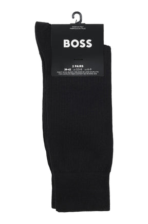 Men's black ribbed two-pack socks on branded hang card with large BOSS logo and size text, product view by HUGO BOSS