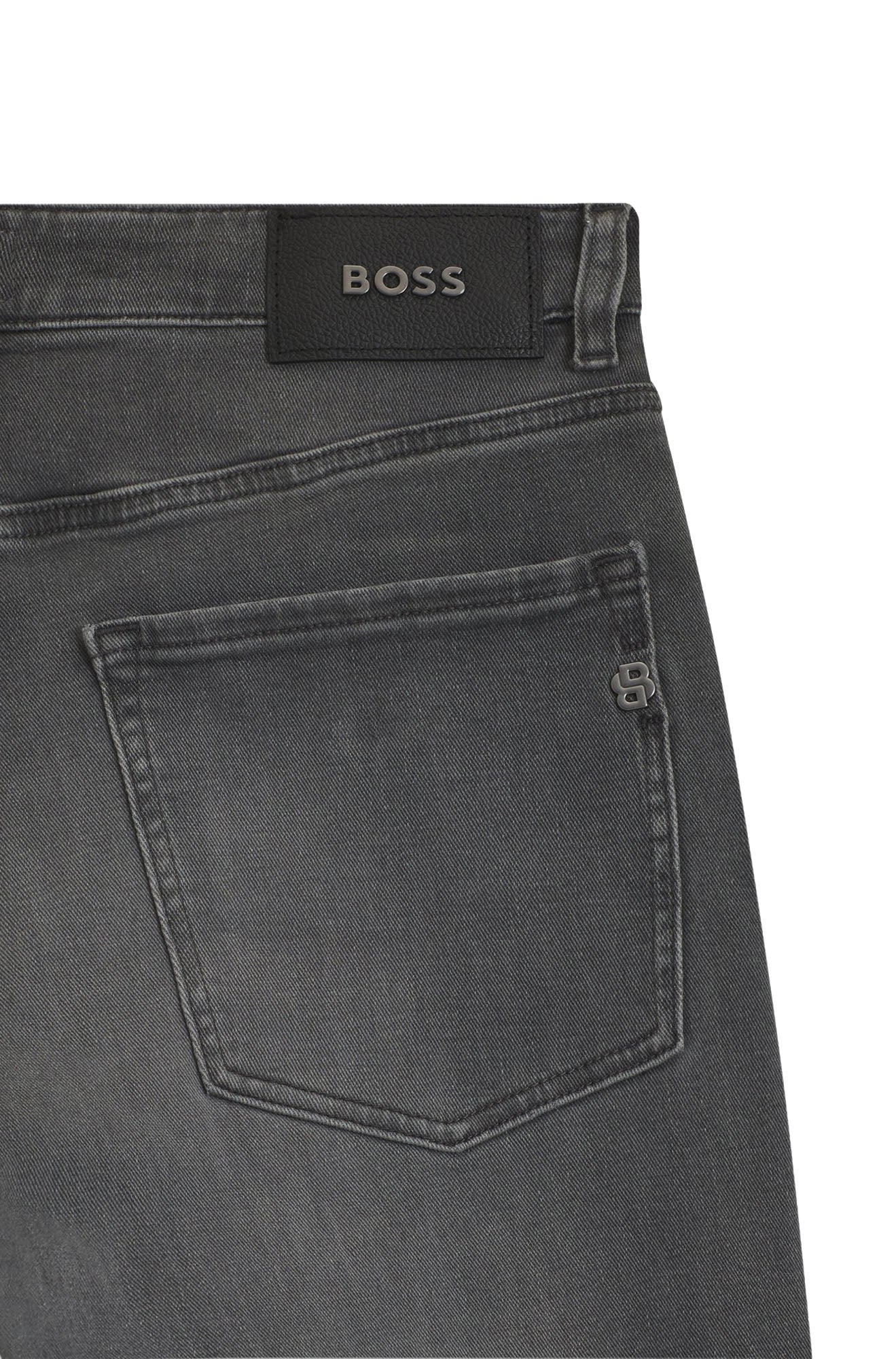 HUGO BOSS men's close detail of gray straight-leg jeans back pocket with black BOSS patch and small metal emblem