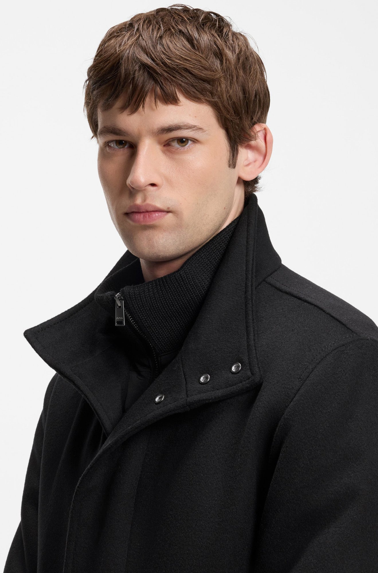 HUGO BOSS men's black winter coat collar with silver snaps, zipper pull and brushed texture, close-up