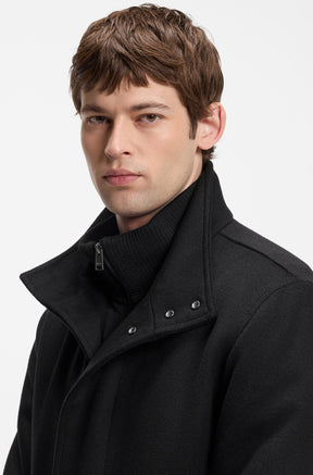 HUGO BOSS men's black winter coat collar with silver snaps, zipper pull and brushed texture, close-up