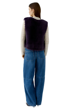 Oui women's dark purple faux fur sleeveless vest worn over a cream lace long sleeve top shown from the back