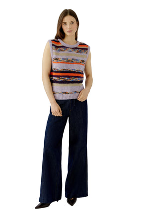 Women's full-length front view of lavender striped knit sweater vest styled with dark wide-leg jeans by Oui