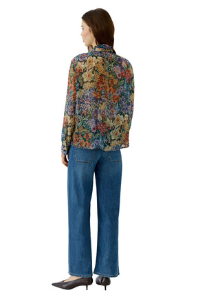 Oui women's multicolor floral long-sleeve blouse with stand collar and, worn with jeans, back view