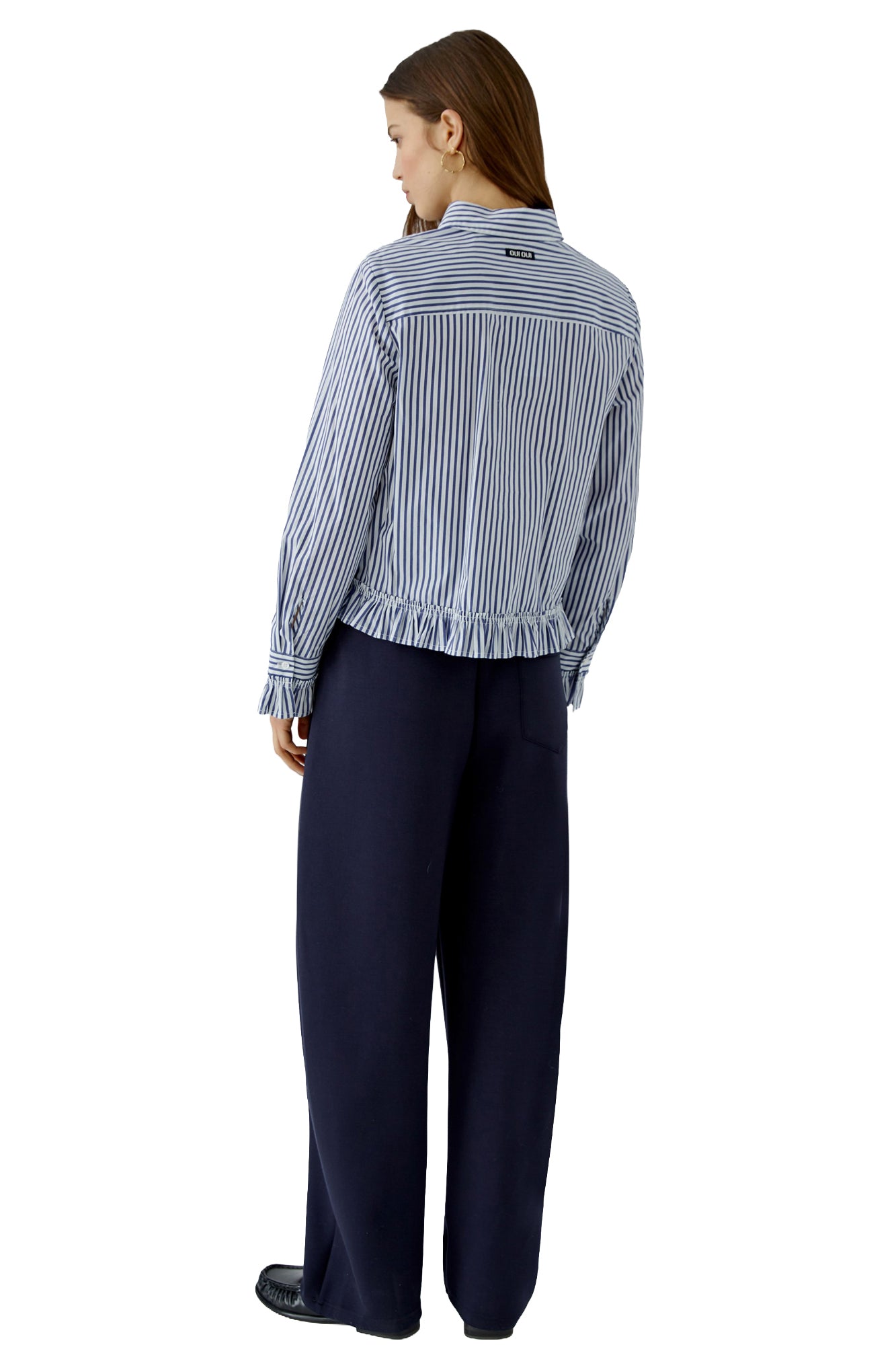 Oui women's blue and white striped long-sleeve blouse with ruffled hem, cuffs, and neck label, back model view