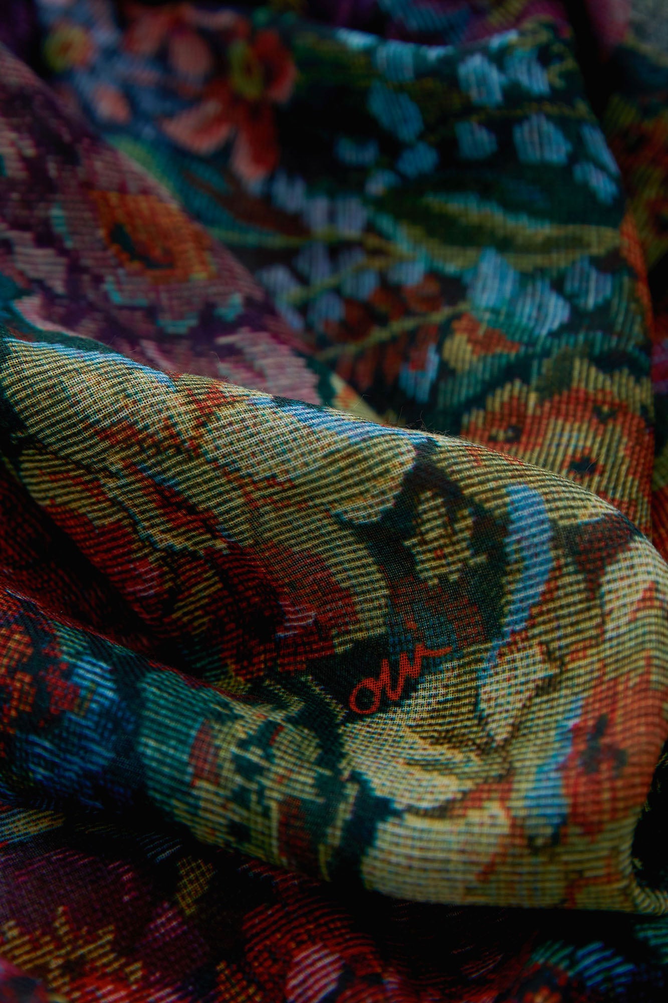 Oui women's multicolor floral scarf fabric showing fine woven texture and dark teal base, close-up