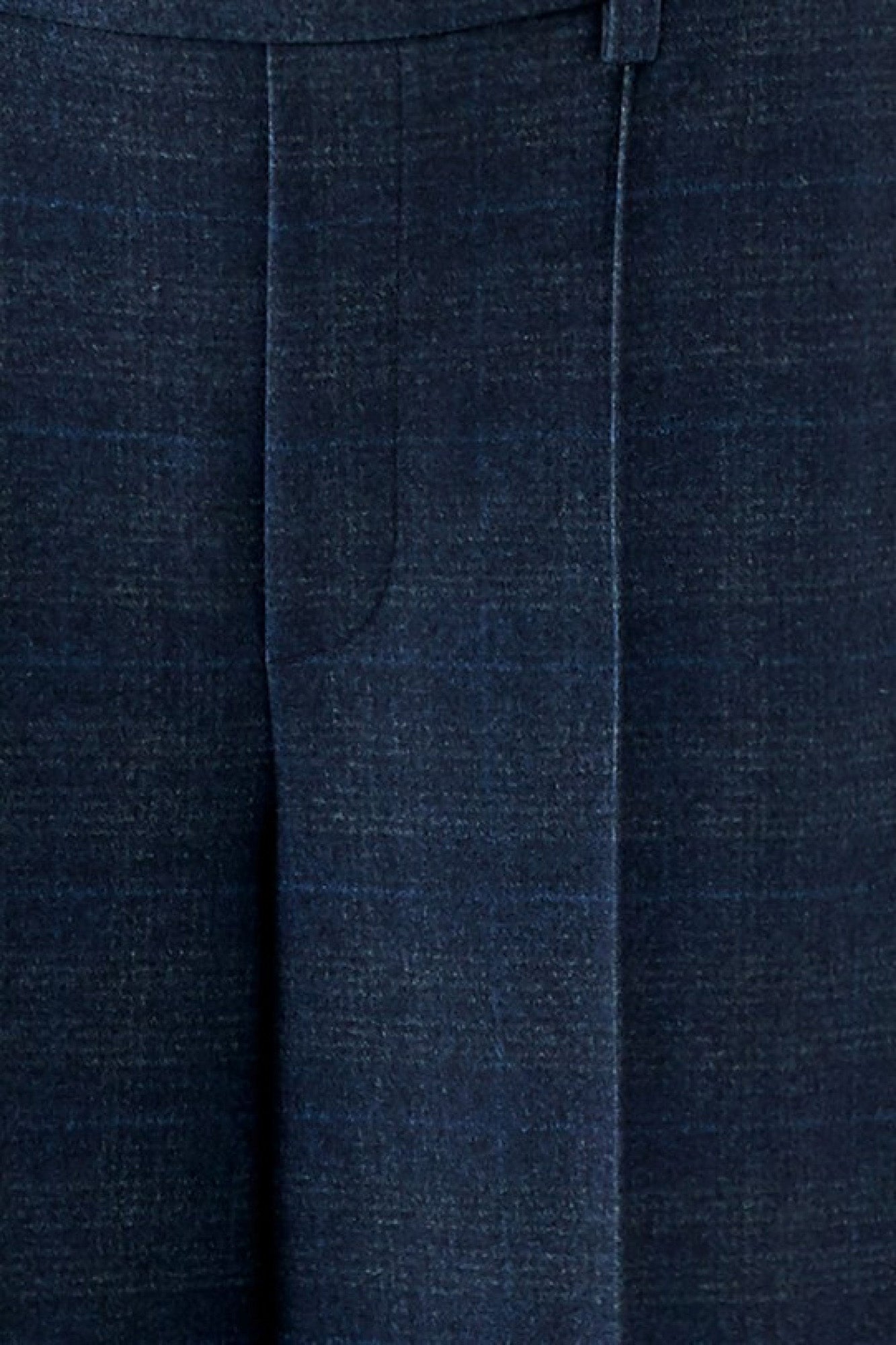 Women's close detail of dark navy textured wide-leg pants fabric with stitched seam and pressed crease by Oui