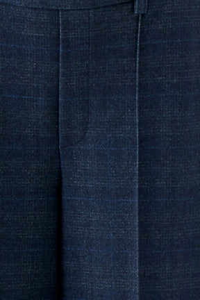 Women's close detail of dark navy textured wide-leg pants fabric with stitched seam and pressed crease by Oui