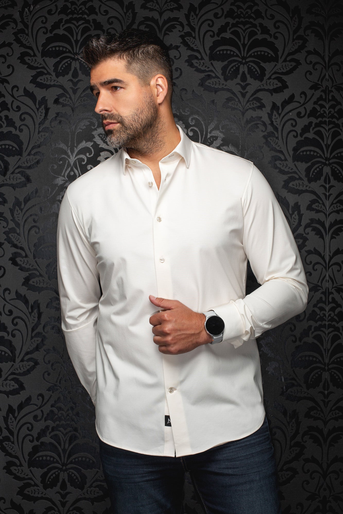 Front view of men's white long sleeve button-up shirt with curved hem and pointed collar by Au Noir