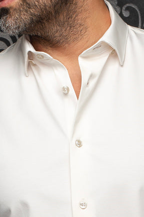 Au Noir men's white button-up shirt collar with smooth fabric and pearl-like buttons, close-up
