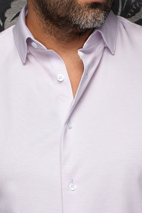 Au Noir men's white shirt collar, black patterned placket, dark buttons, and abstract print, close-up