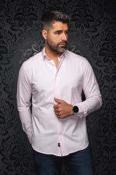 Au Noir men's light pink long sleeve button-up shirt with white buttons and curved hem on model, front view
