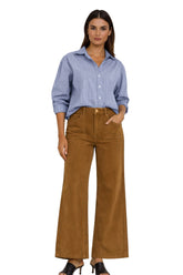 Carreli Jeans women's brown high-waisted wide-leg pants with patch pockets, belt loops, and button fly shown from the front