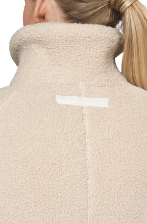Ilse Jacobsen women's cream teddy fleece jacket back collar with subtle rectangular logo label, close-up