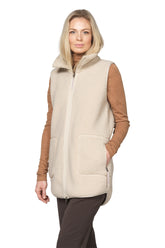 Women's front angled model view of cream curly fleece vest with stand collar, zipper and patch pockets by Ilse Jacobsen