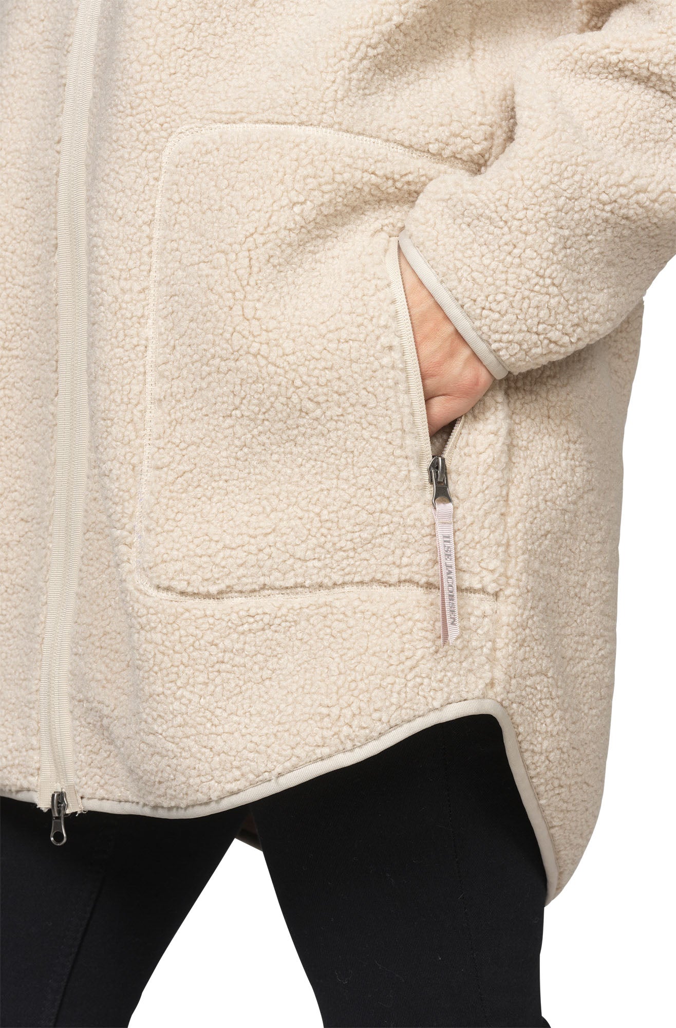 Ilse Jacobsen women's cream teddy fleece coat pocket with zipper pull, bound trim and plush texture, close-up
