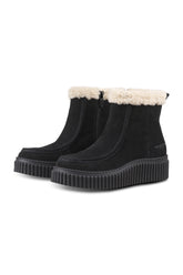 Women's black ankle boots angled front view with cream plush cuff, side zipper, and ribbed sole by Ilse Jacobsen
