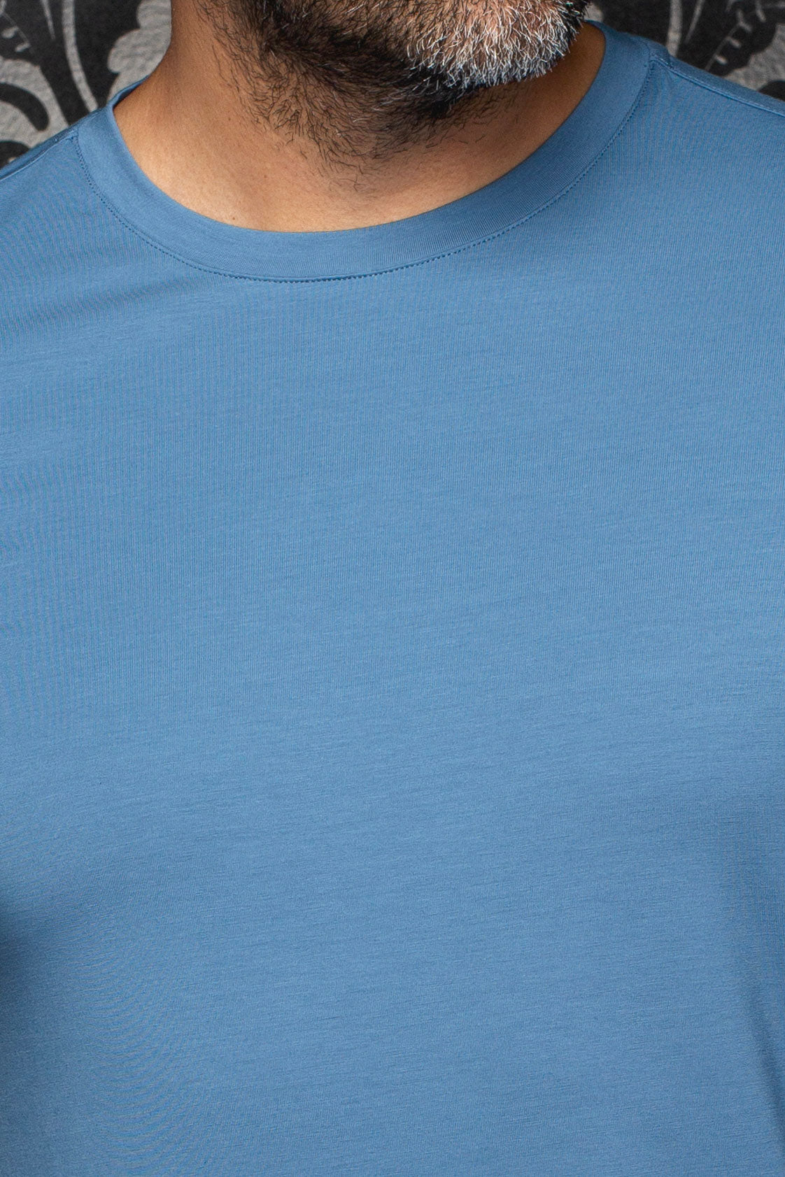 Au Noir men's blue Short-sleeve T-Shirt shown close-up with fine jersey texture and ribbed crew neck