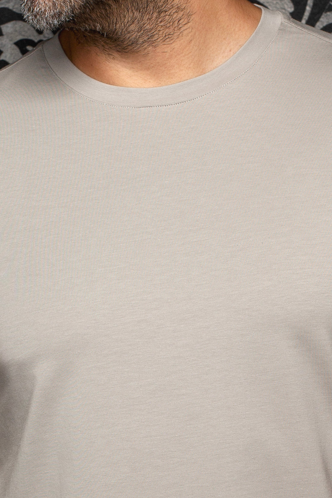 Au Noir men's light gray crewneck Short-sleeve T-Shirt shown close-up with smooth knit and ribbed collar stitching