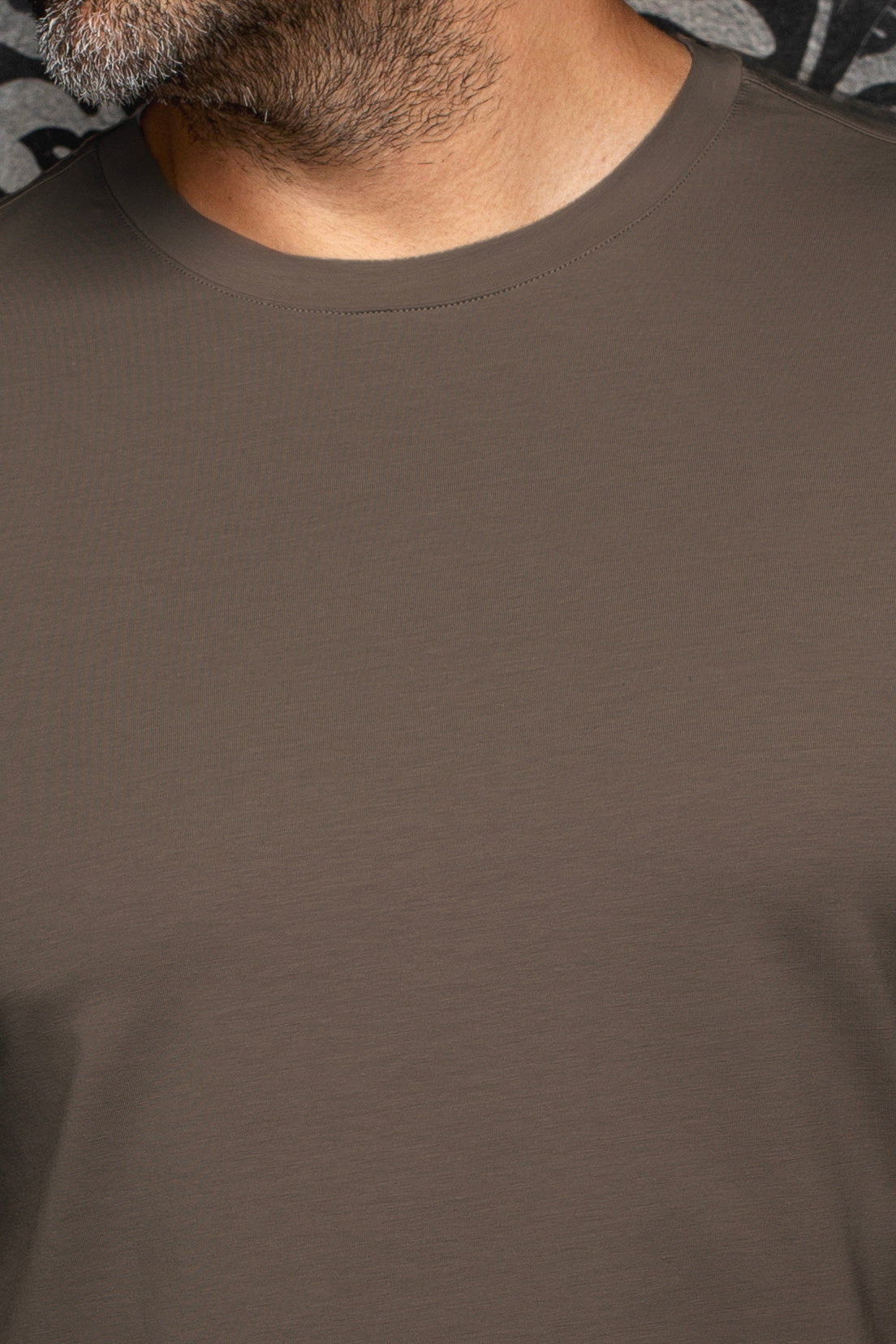 Au Noir men's brown Short-sleeve T-Shirt shown close-up with smooth jersey texture and ribbed crewneck collar