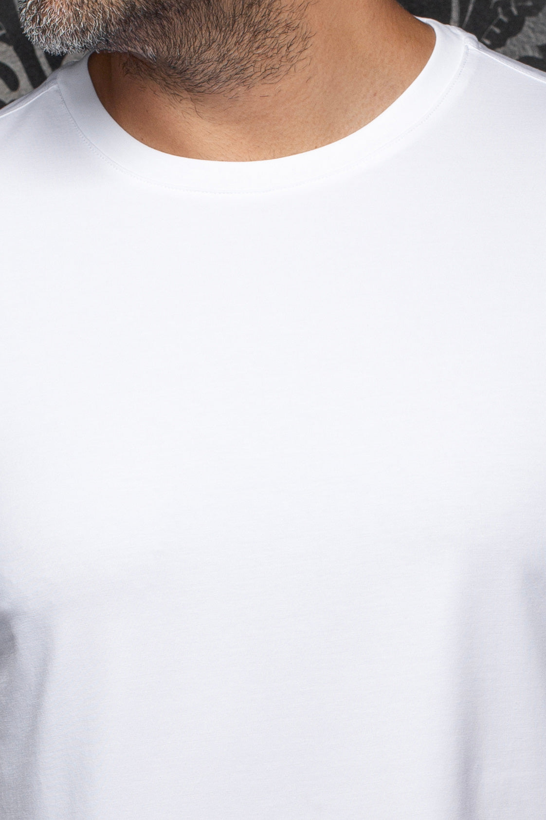 Au Noir men's plain white Short-sleeve T-Shirt crewneck, shown close-up with smooth jersey and stitched neckline