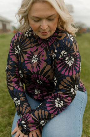 Women's close angled view of black floral mock-neck long sleeve T-Shirt by Rien ne se perd, tout se crée