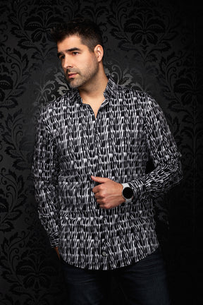Au Noir men's angled model view of black and white abstract print button-up shirt with open collar shown from the side