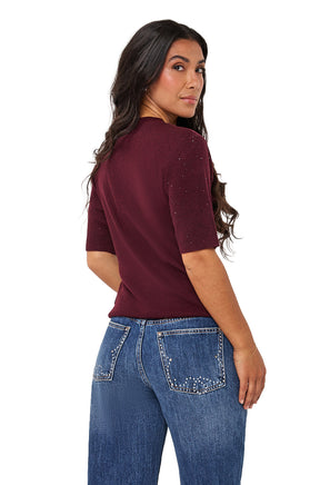 Women's angled back view of a burgundy ribbed Short-sleeve T-Shirt with sparkle accents on the sleeve by Esqualo