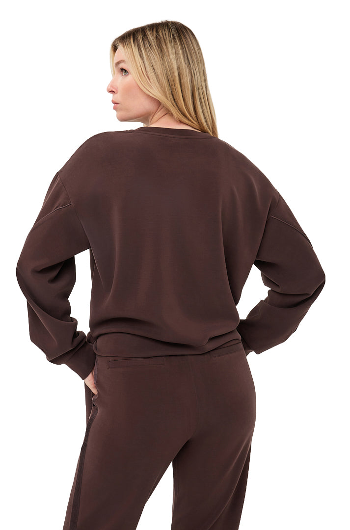 Esqualo women's back waist-up view of dark brown crewneck sweatshirt with dropped shoulders and ribbed hem