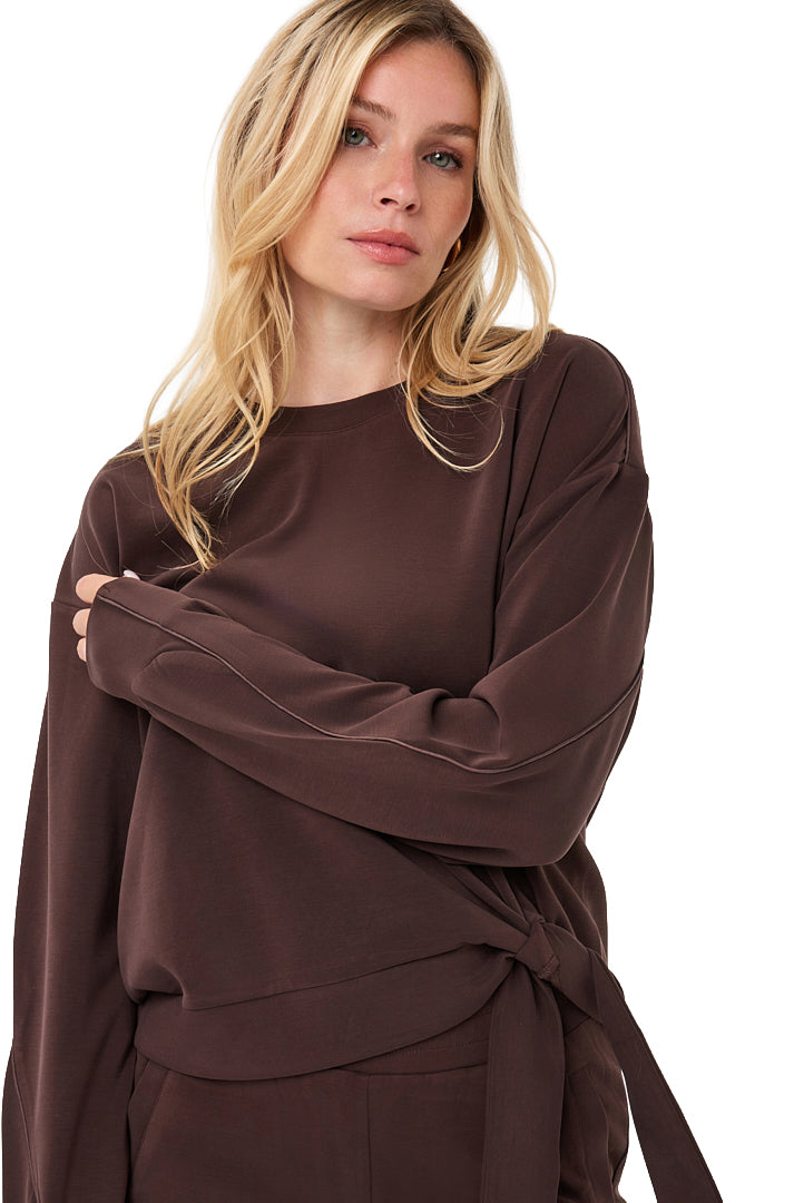 Women's front close view of dark brown crewneck sweatshirt with long sleeves and side tie hem by Esqualo