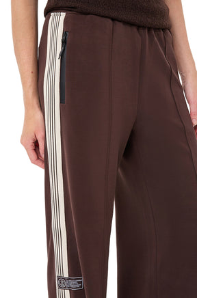 Esqualo women's brown wide-leg pants with cream striped side trim and black zip pocket, close view