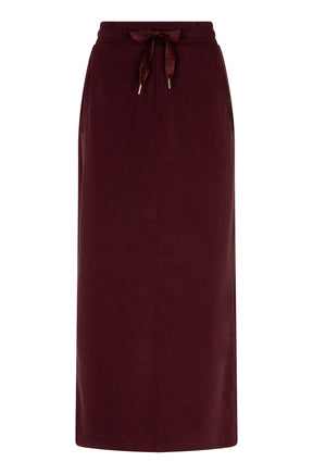 Front view of women's burgundy long skirt with drawstring waist and slanted side pockets by Esqualo