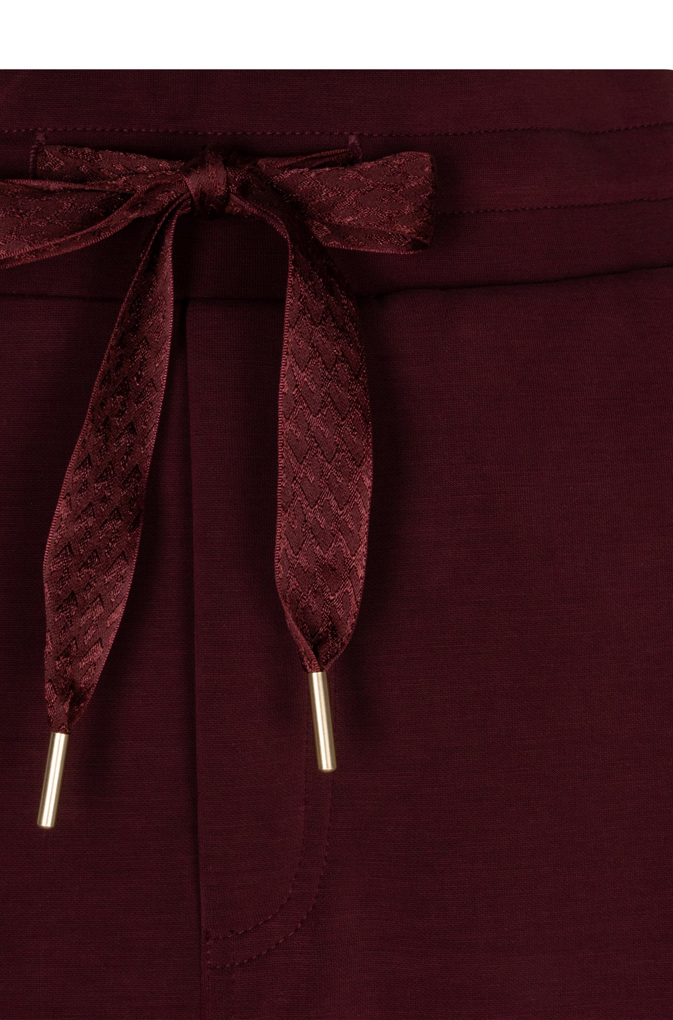 Esqualo women's burgundy skirt waistband with patterned drawstring and gold-tone tips, close-up