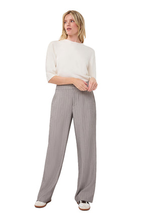 Esqualo women's full front view of ivory short sleeve knit T-Shirt with ribbed hem, styled with gray wide-leg pants
