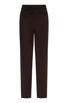 Pantalon jambe droite brun foncé isolé de dos avec taille élastiquée et poches passepoilées pour femme par Esqualo