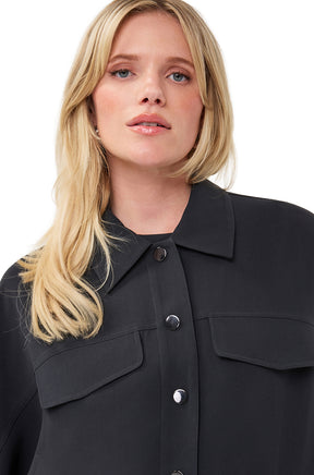 Esqualo women's black blouse collar, shiny front buttons, and chest flap pockets, close-up