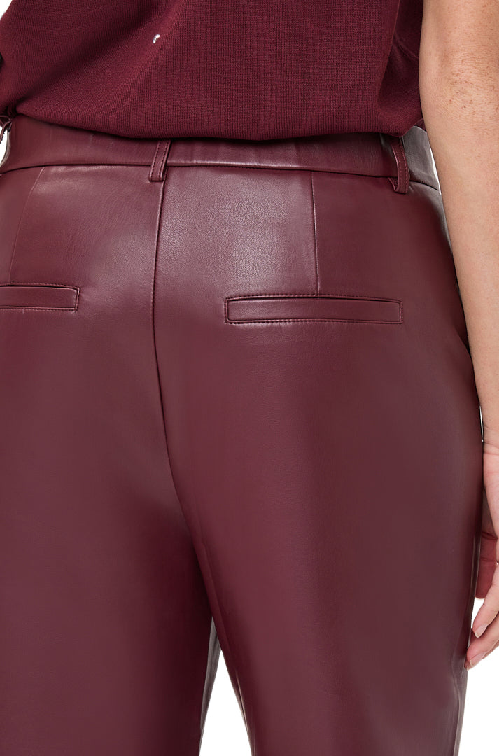 Women's close-up back view of burgundy faux leather wide-leg pants showing belt loops and welt pockets by Esqualo