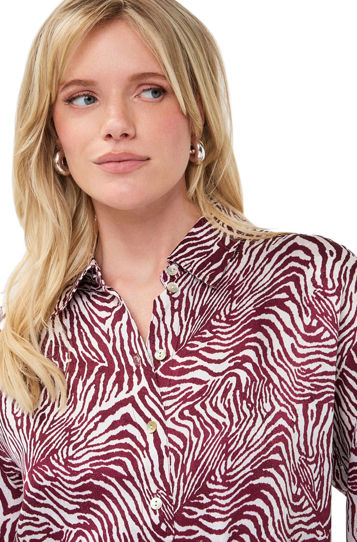 Esqualo women's ivory and burgundy printed long-sleeve blouse showing point collar and light button placket, close-up