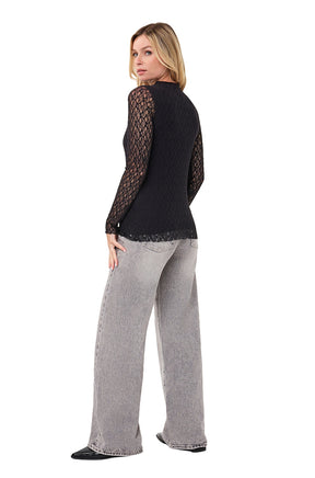 Women's angled back view of black lace mock neck long-sleeve blouse with sheer sleeves and scalloped hem by Esqualo