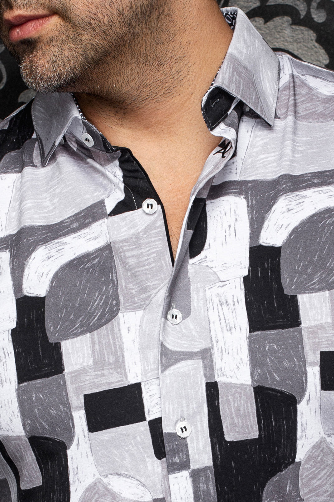 Au Noir men's gray abstract print button-up shirt with white buttons and spread collar, close-up